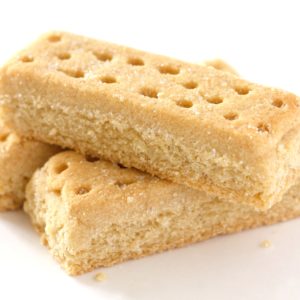Two pieces of shortbread are stacked on top of each other.