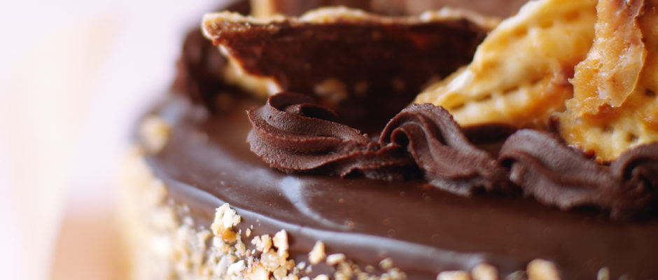 A close up of a chocolate cake with nuts