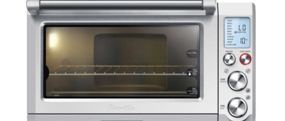 A toaster oven with an lcd screen on it.