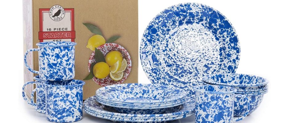 A set of blue and white plates next to a card.