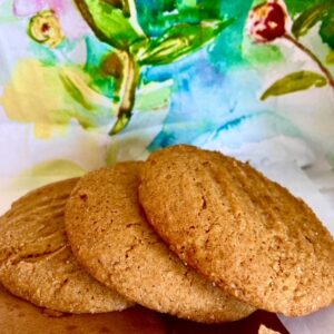 Three cookies sitting on top of a plate.