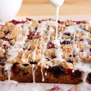A close up of a cake with white icing