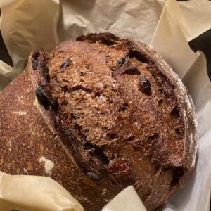 A loaf of bread with raisins in it.