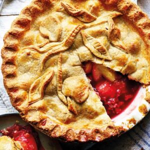 A pie with some fruit inside of it